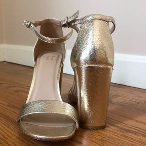 Gold “a new day” target heels